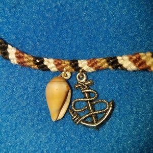 Hemp cord bracelet with seashell and anchor charm